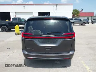 2023 Chrysler Pacifica Touring L with VIN 2C4RC1BG6PR590302, listed as a IAAI auction lot 42451369 with 72,097 mi miles and . Bid and sale history available at DreamBid. Image 16.