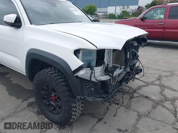 2021 Toyota Tacoma SR5 z VIN 3TMDZ5BN2MM100245, wystawiony jako IAAI lot #42078914 z przebiegiem 58 153 mil mil oraz . Historia ofert i sprzedaży dostępna na DreamBid. Obrazek 18.