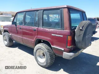 1991 Isuzu Trooper z VIN JACCH58R8M7904079, wystawiony jako IAAI lot #42303036 z przebiegiem 244 672 mil mil oraz . Historia ofert i sprzedaży dostępna na DreamBid. Obrazek 3.