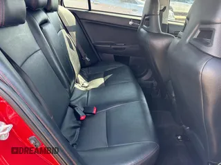 2012 Mitsubishi Lancer Evolution GSR z VIN JA32W8FV0CU019216, wystawiony jako Copart lot #75898944 z przebiegiem 129 387 mil mil oraz Tytuł czysty. Historia ofert i sprzedaży dostępna na DreamBid. Obrazek 6.