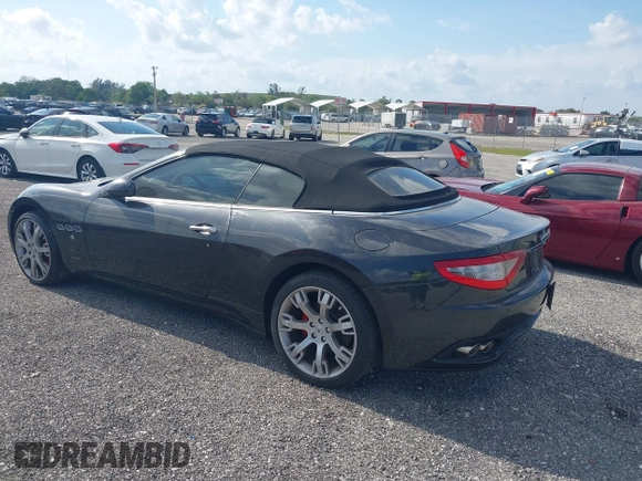 2013 Maserati GranTurismo Convertible Sport with VIN ZAM45MMA2D0069786, listed as a IAAI auction lot 40874830 with 37,312 mi miles. Bid and sale history available at carsss.com. Image 3.