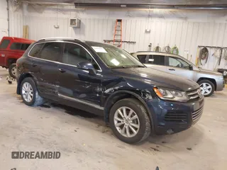 2014 Volkswagen Touareg Sport with VIN WVGEF9BP9ED008967, listed as a IAAI auction lot 41984409 with 193,859 mi miles and . Bid and sale history available at DreamBid. Image 1.