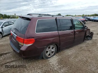 2010 Honda Odyssey Touring with VIN 5FNRL3H94AB056657, listed as a Copart auction lot 72658934 with 202,690 mi miles and Salvage title. Bid and sale history available at DreamBid. Image 3.