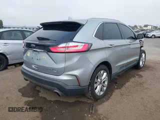 2020 Ford Edge Titanium z VIN 2FMPK4K95LBA16379, wystawiony jako IAAI lot #41190704 z przebiegiem 69 076 mil mil oraz . Historia ofert i sprzedaży dostępna na DreamBid. Obrazek 4.