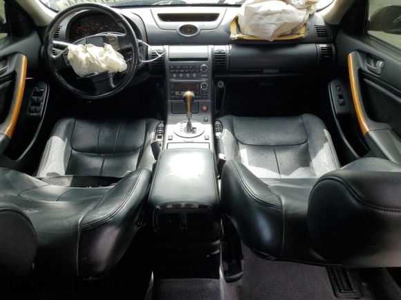 2004 Infiniti G35 w/Leather with VIN JNKCV51F94M717606, listed as a Copart auction lot 74712714 with 197,420 mi miles and Salvage Title. Bid and sale history available at DreamBid. Image 8.