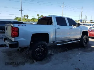 2017 Chevrolet Silverado 1500 LT with VIN 3GCUKREC0HG470703, listed as a Copart auction lot 53667145 with 167,689 mi miles and Salvage Title. Bid and sale history available at DreamBid. Image 3.