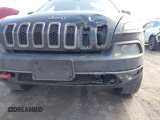 2014 Jeep Cherokee Trailhawk with VIN 1C4PJMBS3EW127749, listed as a IAAI auction lot 41836617 with 207,002 mi miles and . Bid and sale history available at DreamBid. Image 6.