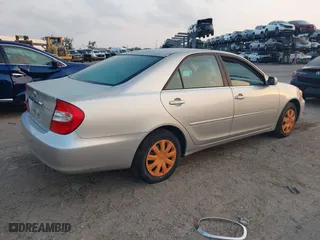 2002 Toyota Camry LE with VIN 4T1BE32K42U011553, listed as a IAAI auction lot 42054226 with 223,683 mi miles. Bid and sale history available at carsss.com. Image 4.
