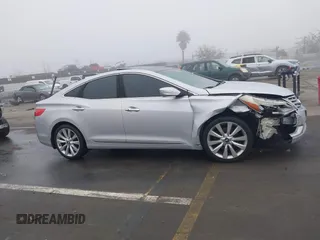 2014 Hyundai Azera Limited with VIN KMHFH4JG7EA388931, listed as a IAAI auction lot 41468407 with 130,597 mi miles and . Bid and sale history available at DreamBid. Image 13.