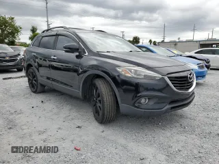 2015 Mazda CX-9 Grand Touring z VIN JM3TB2DA8F0457807, wystawiony jako Copart lot #61803555 z przebiegiem 110 104 mil mil oraz Czysty tytuł • Clean title. Historia ofert i sprzedaży dostępna na DreamBid. Obrazek 4.