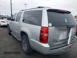 2010 Chevrolet Suburban LT with VIN 1GNUCJE03AR238548, listed as a IAAI auction lot 42104596 with 153,959 mi miles and . Bid and sale history available at DreamBid. Image 3.