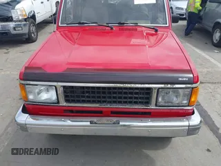 1991 Isuzu Trooper z VIN JACCH58R0M7904092, wystawiony jako IAAI lot #41900283 z przebiegiem 226 780 mil mil oraz . Historia ofert i sprzedaży dostępna na DreamBid. Obrazek 6.