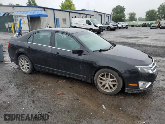 2012 Ford Fusion SEL with VIN 3FAHP0JA1CR348101, listed as a Copart auction lot 60995195 with 147,212 mi miles and Clean title. Bid and sale history available at DreamBid. Image 4.