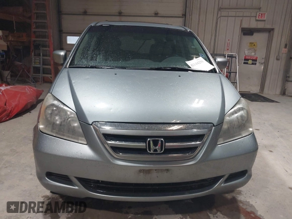 2007 Honda Odyssey EX-L with VIN 5FNRL38697B012944, listed as a IAAI auction lot 42144250 with 234,016 mi miles and . Bid and sale history available at DreamBid. Image 12.