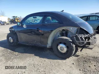 2014 Volkswagen Beetle 2.5L PZEV with VIN 3VWHP7AT1EM606988, listed as a Copart auction lot 46456155 with 39,911 mi miles and Salvage Title. Bid and sale history available at carsss.com. Image 2.