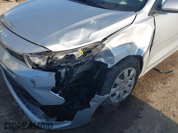 2023 Kia Rio S z VIN 3KPA24AD2PE545609, wystawiony jako IAAI lot #41993823 z przebiegiem 12 186 mil mil oraz . Historia ofert i sprzedaży dostępna na DreamBid. Obrazek 6.