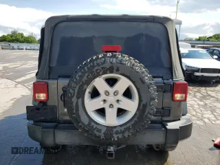 2017 Jeep Wrangler Willys Wheeler with VIN 1C4AJWAG2HL527192, listed as a Copart auction lot 58169245 with 88,737 mi miles and Salvage title. Bid and sale history available at DreamBid. Image 6.