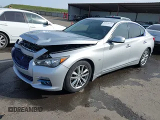 2014 Infiniti Q50 Premium with VIN JN1BV7AP2EM679481, listed as a IAAI auction lot 41836371 with 133,393 mi miles. Bid and sale history available at carsss.com. Image 2.