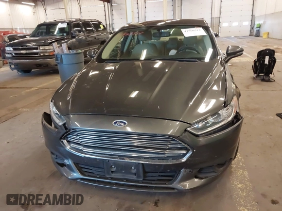 2016 Ford Fusion SE Hybrid with VIN 3FA6P0LU9GR235291, listed as a IAAI auction lot 41560312 with 112,777 mi miles. Bid and sale history available at carsss.com. Image 11.