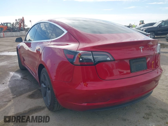 2020 Tesla Model 3 Standard Range Plus with VIN 5YJ3E1EA9LF718027, listed as a IAAI auction lot 41679320 with 68,987 mi miles. Bid and sale history available at carsss.com. Image 3.