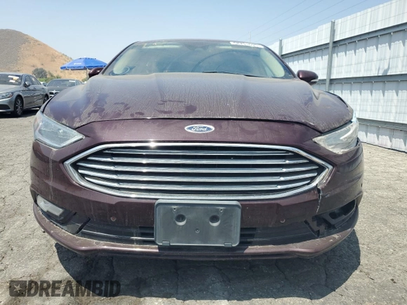 2017 Ford Fusion Titanium z VIN 3FA6P0SU8HR313773, wystawiony jako Copart lot #58791695 z przebiegiem 141 777 mil mil oraz Czysty tytuł • Clean title. Historia ofert i sprzedaży dostępna na DreamBid. Obrazek 5.