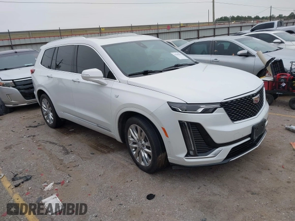 2021 Cadillac XT6 Premium Luxury z VIN 1GYKPCRSXMZ169206, wystawiony jako IAAI lot #41581841 z przebiegiem 64 789 mil mil oraz . Historia ofert i sprzedaży dostępna na DreamBid. Obrazek 1.