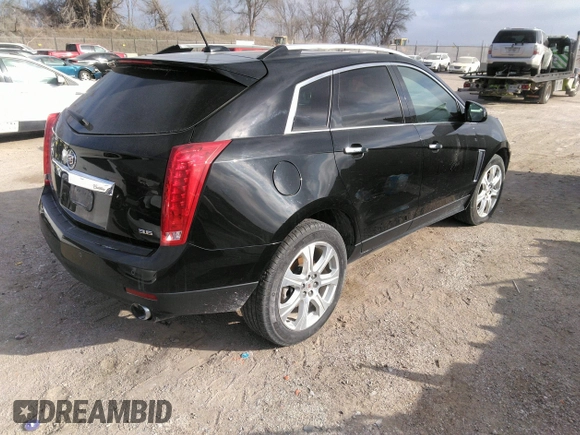 2016 Cadillac SRX Performance Collection z VIN 3GYFNCE32GS505552, wystawiony jako IAAI lot #40949642 z przebiegiem 143 343 mil mil oraz . Historia ofert i sprzedaży dostępna na DreamBid. Obrazek 4.