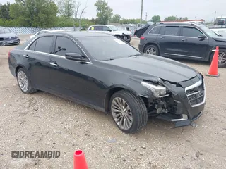2014 Cadillac CTS Luxury AWD z VIN 1G6AX5SX9E0197395, wystawiony jako IAAI lot #42211452 z przebiegiem 90 657 mil mil oraz . Historia ofert i sprzedaży dostępna na DreamBid. Obrazek 1.