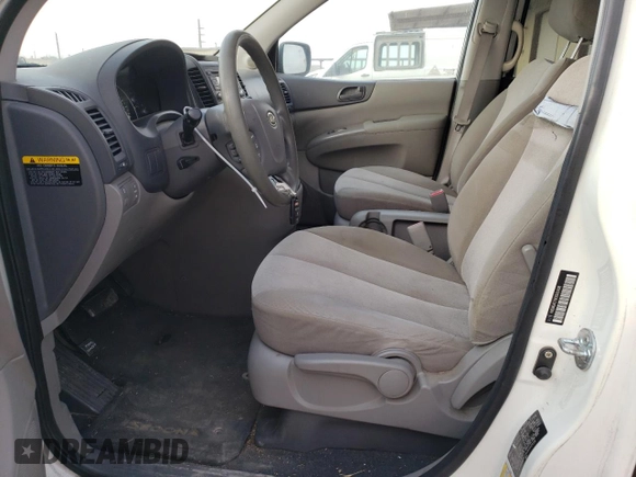2012 Kia Sedona LX with VIN KNDMG4C79C6502438, listed as a Copart auction lot 77833384 with 169,459 mi miles and Clean Title. Bid and sale history available at carsss.com. Image 7.