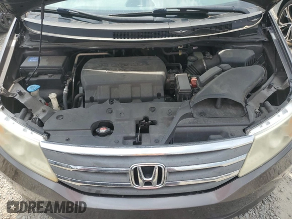 2012 Honda Odyssey Touring with VIN 5FNRL5H94CB102177, listed as a Copart auction lot 55942185 with 179,418 mi miles and Salvage Title. Bid and sale history available at DreamBid. Image 12.