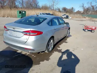 2018 Ford Fusion SE with VIN 3FA6P0LU1JR272522, listed as a IAAI auction lot 41796432 with 123,471 mi miles and . Bid and sale history available at DreamBid. Image 4.