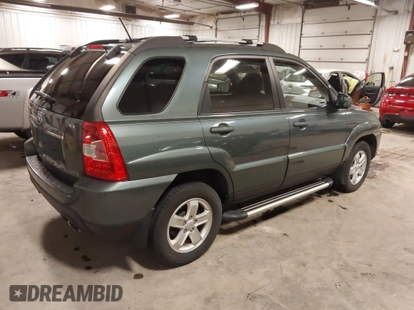 2009 Kia Sportage LX with VIN KNDJE723097558182, listed as a IAAI auction lot 41295142 with 147,200 mi miles. Bid and sale history available at carsss.com. Image 4.