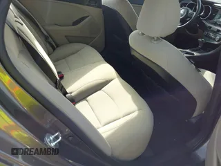 2015 Kia Optima LX with VIN 5XXGM4A77FG403664, listed as a IAAI auction lot 42471658 with 76,352 mi miles and . Bid and sale history available at DreamBid. Image 8.