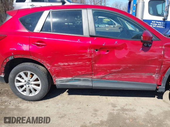 2014 Mazda CX-5 Touring with VIN JM3KE2CY2E0374440, listed as a IAAI auction lot 41634144 with 106,145 mi miles and . Bid and sale history available at DreamBid. Image 6.