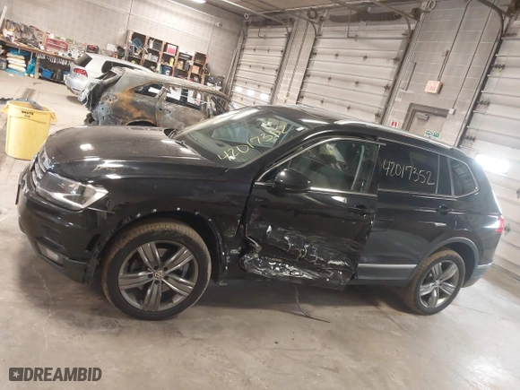 2020 Volkswagen Tiguan SE with VIN 3VV2B7AX4LM115131, listed as a IAAI auction lot 42017352 with 87,909 mi miles. Bid and sale history available at carsss.com. Image 14.