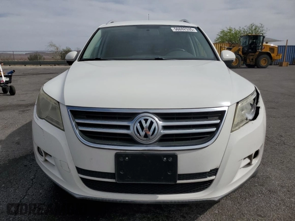 2010 Volkswagen Tiguan Wolfsburg Edition with VIN WVGAV7AX7AW003188, listed as a Copart auction lot 56692535 with 121,502 mi miles and Salvage title. Bid and sale history available at DreamBid. Image 5.