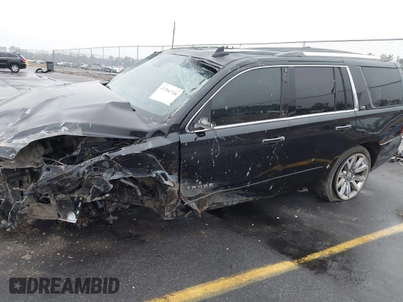 2016 Chevrolet Tahoe LTZ with VIN 1GNSCCKC5GR190061, listed as a IAAI auction lot 41204718 with 174,420 mi miles and . Bid and sale history available at DreamBid. Image 12.