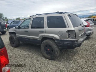 2000 Jeep Grand Cherokee Laredo with VIN 1J4GW48S9YC390448, listed as a Copart auction lot 56985265 with Not provided miles and Salvage title. Bid and sale history available at DreamBid. Image 2.