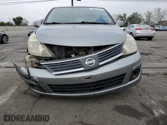 2007 Nissan Versa 1.8 S with VIN 3N1BC13E47L357890, listed as a Copart auction lot 50327045 with 188,445 mi miles and Salvage Title. Bid and sale history available at carsss.com. Image 5.