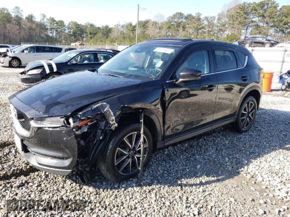 2017 Mazda CX-5 Grand Touring with VIN JM3KFBDL4H0209770, listed as a Copart auction lot 48181935 with 39,128 mi miles and Salvage Title. Bid and sale history available at carsss.com. Image 1.