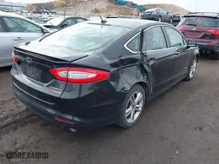 2015 Ford Fusion Titanium Hybrid with VIN 3FA6P0RU6FR299374, listed as a IAAI auction lot 41576007 with 191,285 mi miles. Bid and sale history available at carsss.com. Image 4.