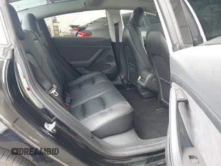 2023 Tesla Model 3 with VIN 5YJ3E1EA7PF473749, listed as a IAAI auction lot 41921478 with 21,483 mi miles and . Bid and sale history available at DreamBid. Image 8.