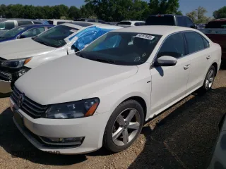 2015 Volkswagen Passat Wolfsburg Edition with VIN 1VWAT7A37FC100517, listed as a Copart auction lot 58757695 with 121,436 mi miles and Salvage title. Bid and sale history available at DreamBid. Image 1.