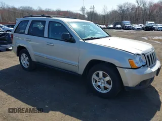2010 Jeep Grand Cherokee Laredo with VIN 1J4PR4GK7AC145095, listed as a IAAI auction lot 41941648 with 92,737 mi miles. Bid and sale history available at carsss.com. Image 1.