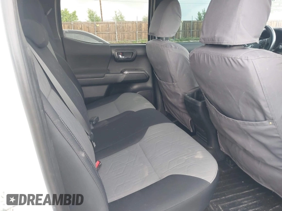 2020 Toyota Tacoma SR5 z VIN 5TFCZ5AN5LX242708, wystawiony jako IAAI lot #42356772 z przebiegiem 65 442 mil mil oraz . Historia ofert i sprzedaży dostępna na DreamBid. Obrazek 8.