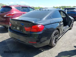 2015 BMW 4 Series 428i with VIN WBA3N7C54FK223490, listed as a IAAI auction lot 42033200 with 145,882 mi miles. Bid and sale history available at carsss.com. Image 4.