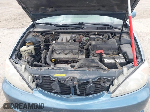 2002 Toyota Camry XLE z VIN 4T1BF32K12U522103, wystawiony jako IAAI lot #42047263 z przebiegiem 293 503 mil mil oraz . Historia ofert i sprzedaży dostępna na DreamBid. Obrazek 10.