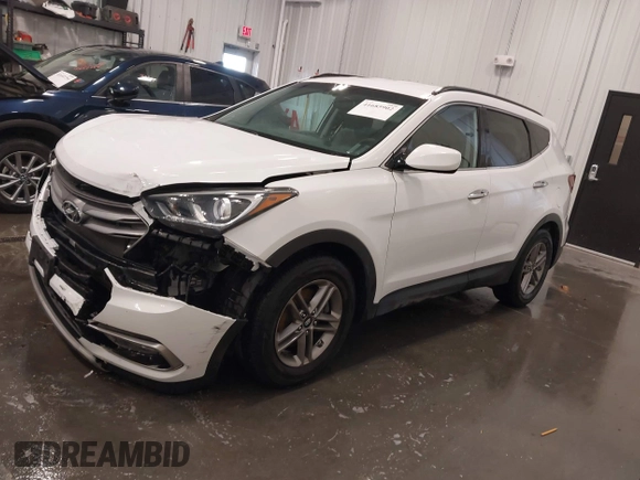 2017 Hyundai Santa Fe 2.4L z VIN 5XYZU3LBXHG444308, wystawiony jako IAAI lot #41685902 z przebiegiem 70 838 mil mil oraz . Historia ofert i sprzedaży dostępna na DreamBid. Obrazek 2.