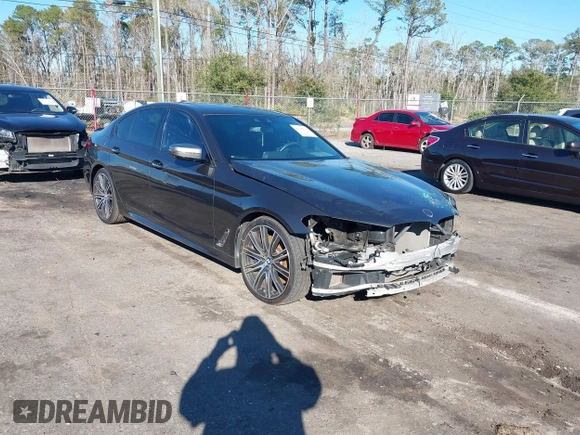 2018 BMW 5 Series M550i xDrive with VIN WBAJB9C57JG463933, listed as a IAAI auction lot 41295711 with 99,173 mi miles and . Bid and sale history available at carsss.com. Image 1.
