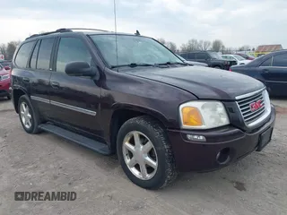 2008 GMC Envoy SLE2 with VIN 1GKDT13S182229108, listed as a IAAI auction lot 42126326 with 156,826 mi miles. Bid and sale history available at carsss.com. Image 1.